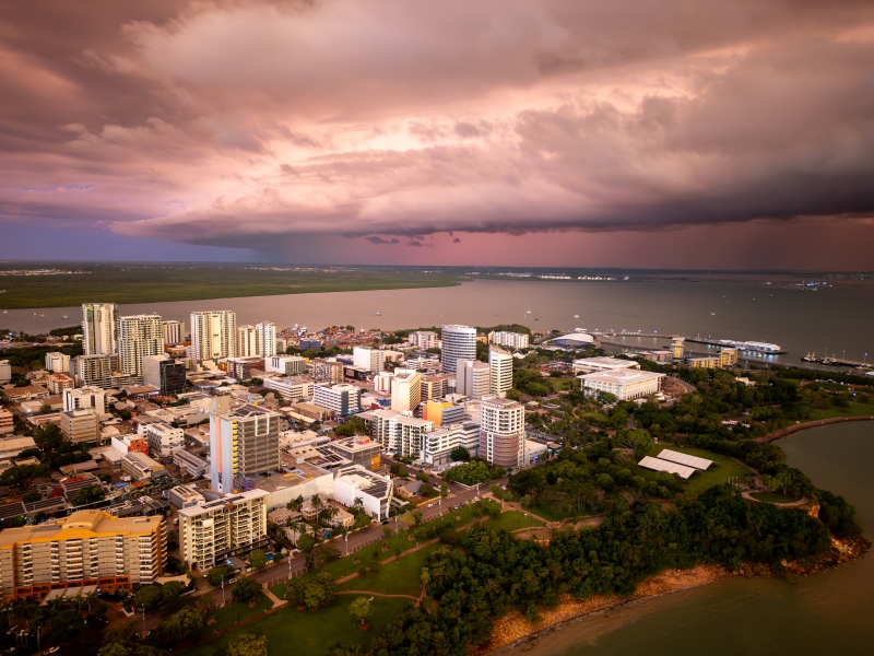 Ariel view of Darwin City, with storm clouds rolling in over the ocean.